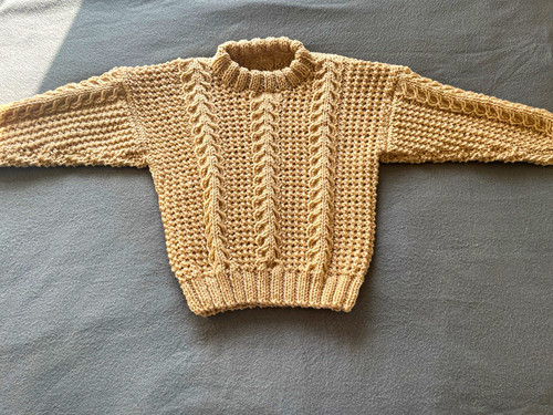 Hand knitted child aran - hand,
