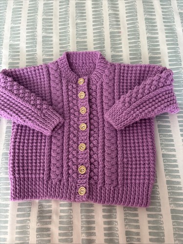 Hand knitted girls aran - hand,